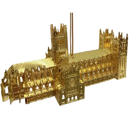 Gold-colored model of a cathedral on a white background